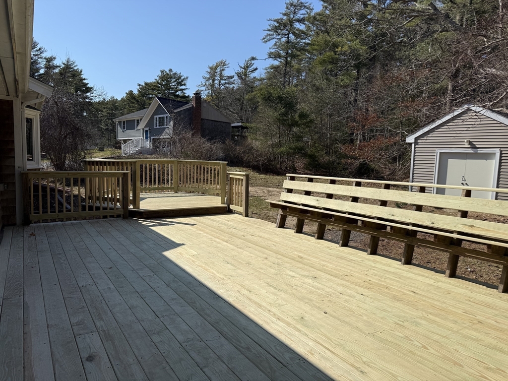 165 Hedges Pond Road Plymouth, MA 02360 - Photo 5 of 20 a view of a swimming pool with seating space