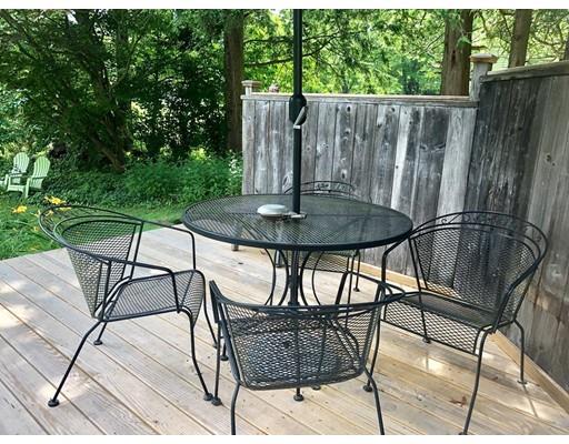 27 Stage Road Westhampton, MA 01027 - Photo 25 of 38 a backyard of a house with table and chairs