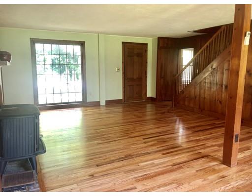 27 Stage Road Westhampton, MA 01027 - Photo 10 of 38 a view of an empty room with wooden floor and a window