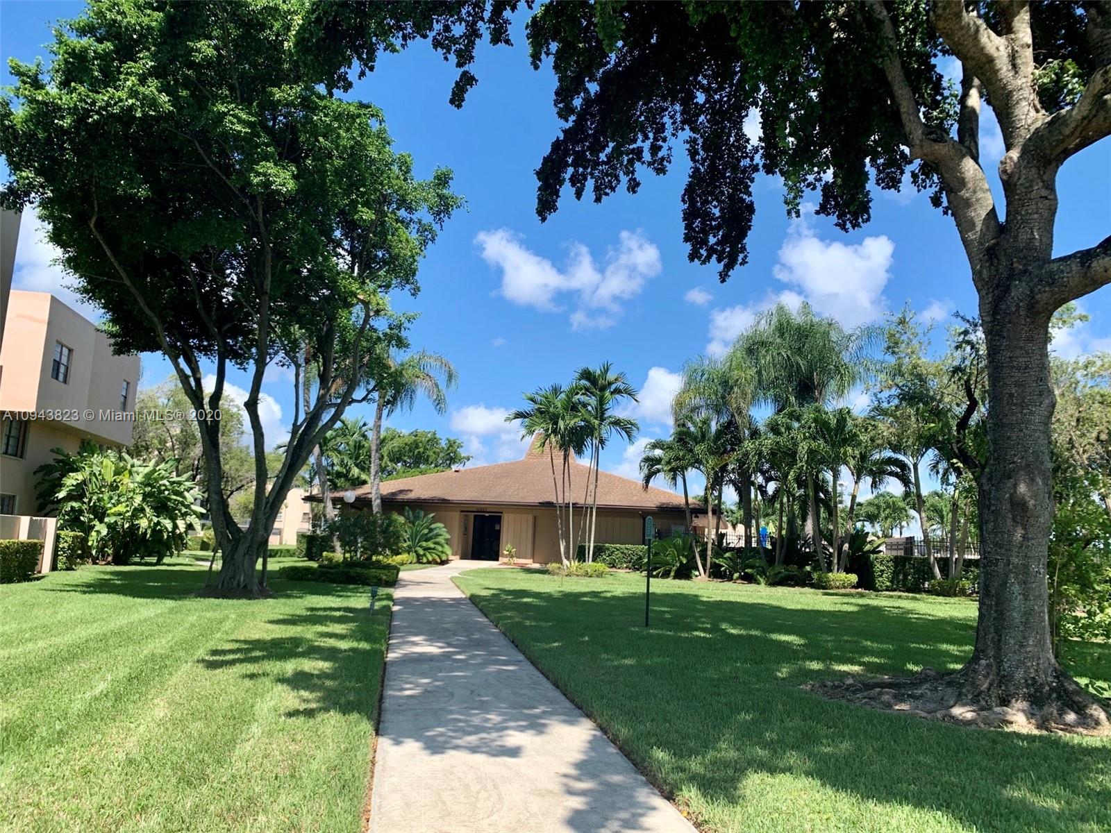 10975 Southwest 107th Street, Unit 117 Miami, FL 33176 - Photo 1 of 13 a view of a garden