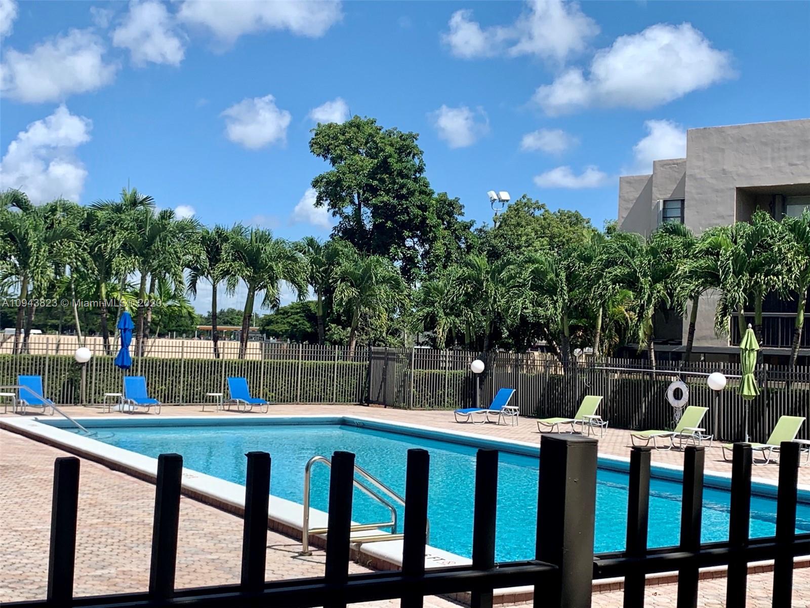 10975 Southwest 107th Street, Unit 117 Miami, FL 33176 - Photo 3 of 13 a view of a chairs and table in the patio