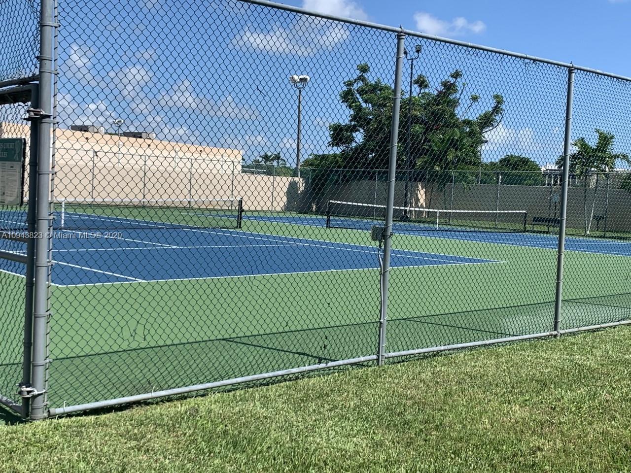 10975 Southwest 107th Street, Unit 117 Miami, FL 33176 - Photo 5 of 13 a view of a tennis court
