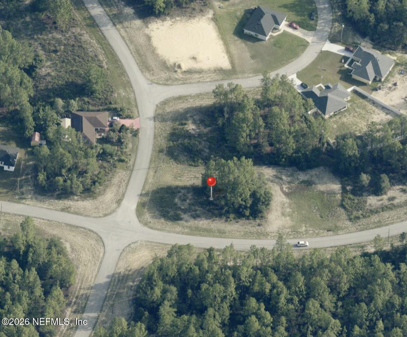 0 Southwest 131st Place Ocala, FL 34473 - Photo 4 of 5 an aerial view of a house with a yard and large trees