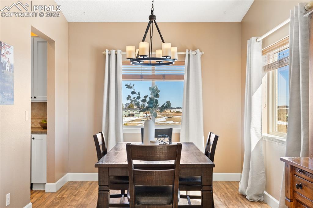 16145 Turftop Terrace Elbert, CO 80106 - Photo 10 of 42 Beautiful dining room with windows and views!