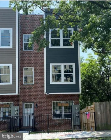 a view of building with a tree front of it
