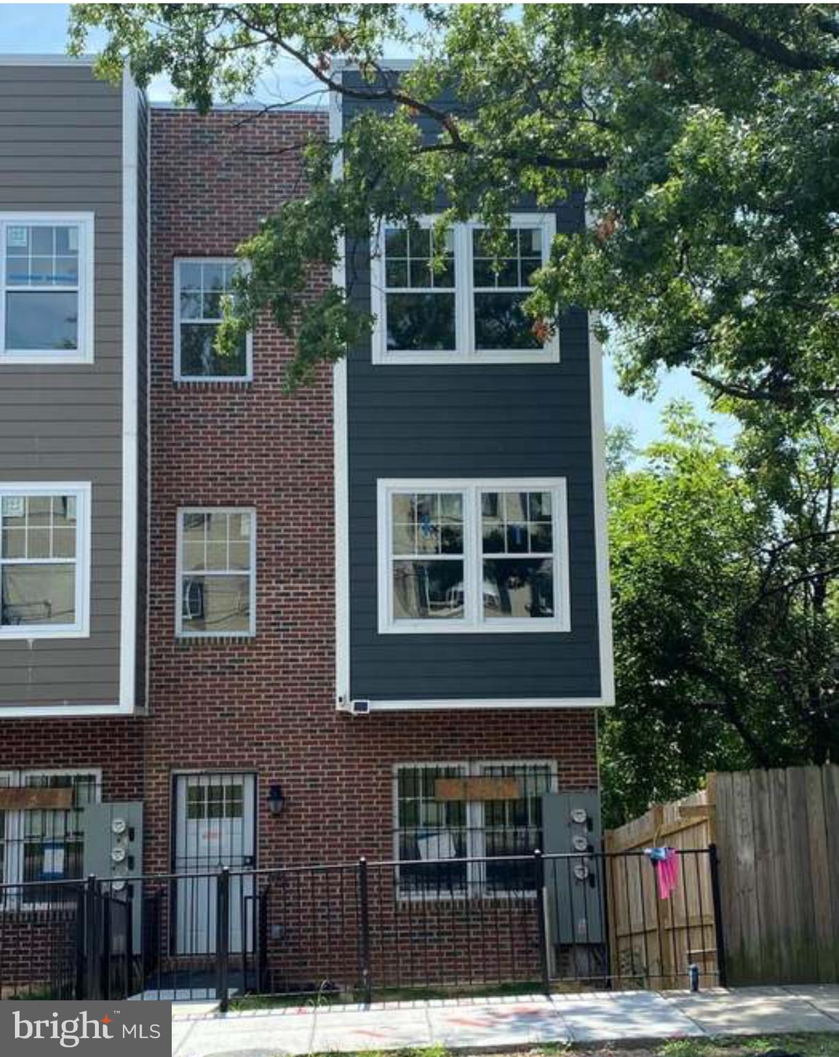 a view of building with a tree front of it