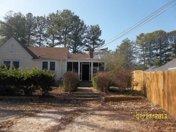 2901 Cocklebur Road Decatur, GA 30034 - Photo 1 of 1 a front view of a house with garden