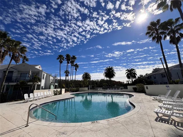 a view of a swimming pool with a patio