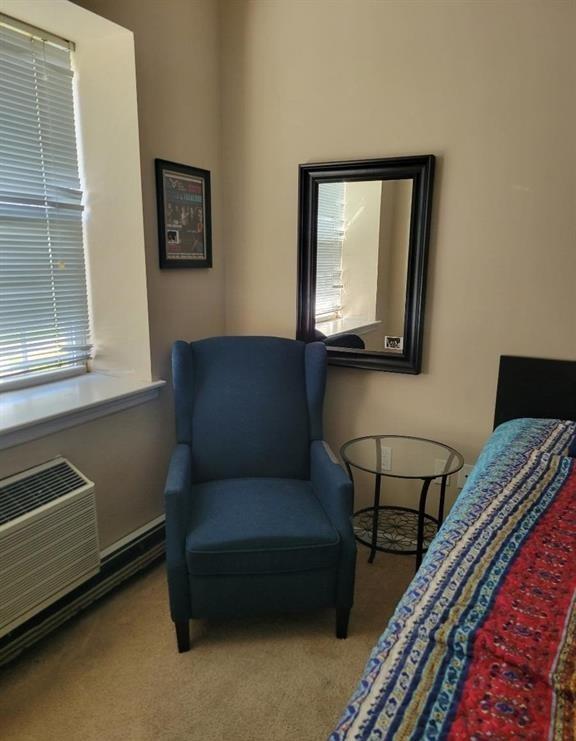 79-14 Rockaway Beach Boulevard, Unit 1J Queens, NY 11693 - Photo 2 of 5 Sitting room featuring carpet flooring and baseboards
