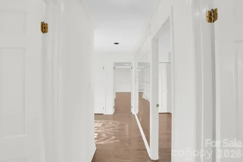 an empty room with windows and pillars in it