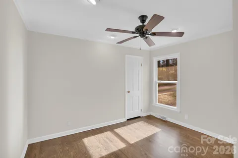 a bathroom with a shower a sink and a mirror