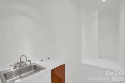 a bathroom with a sink a mirror and a shower