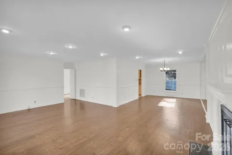 a kitchen with stainless steel appliances granite countertop a refrigerator and a stove