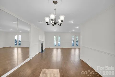 a view of a hallway with white walls