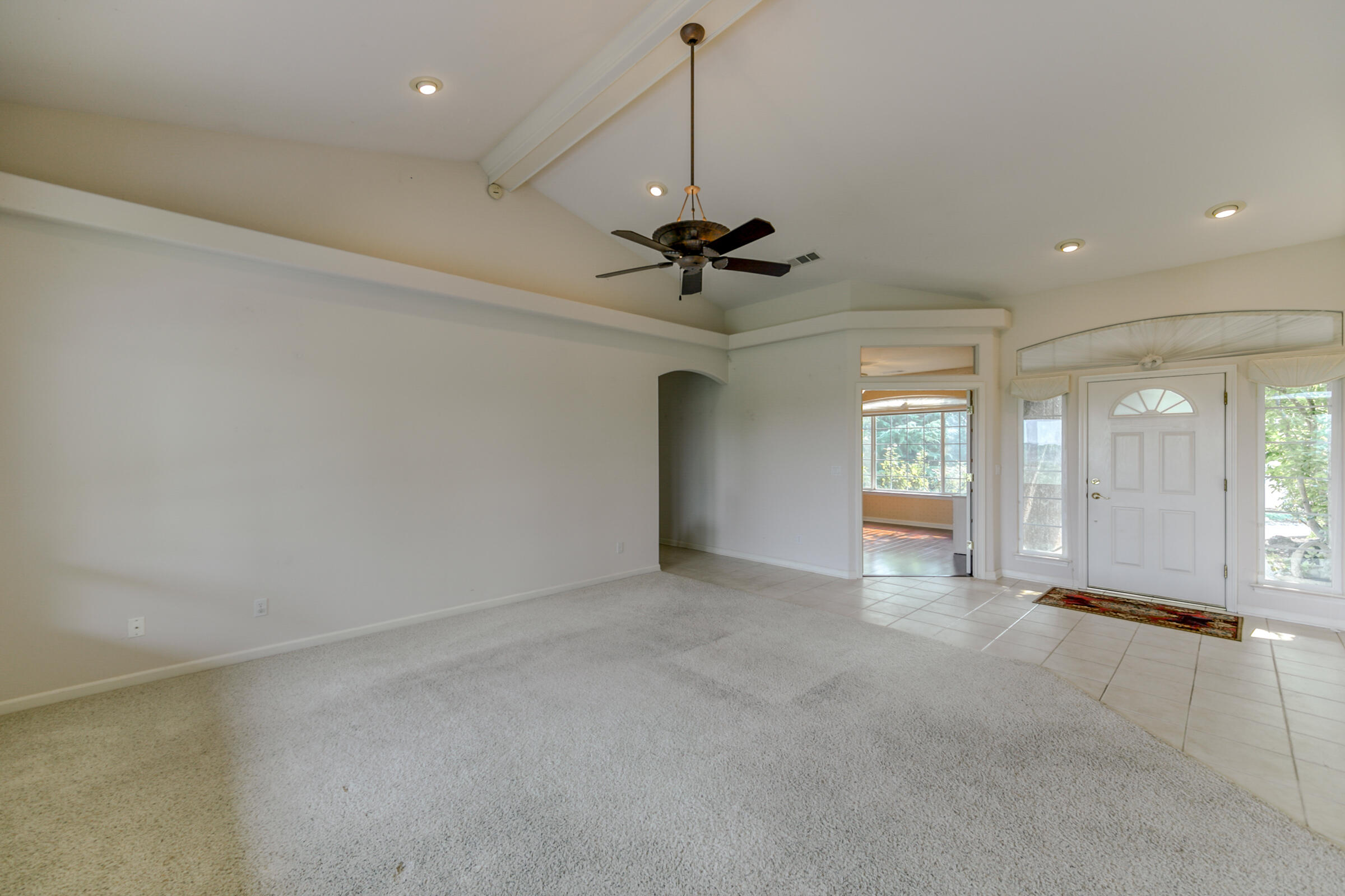 2965 Shadow Brook Lane Redding, CA 96001 - Photo 12 of 38 an empty room with windows and fan