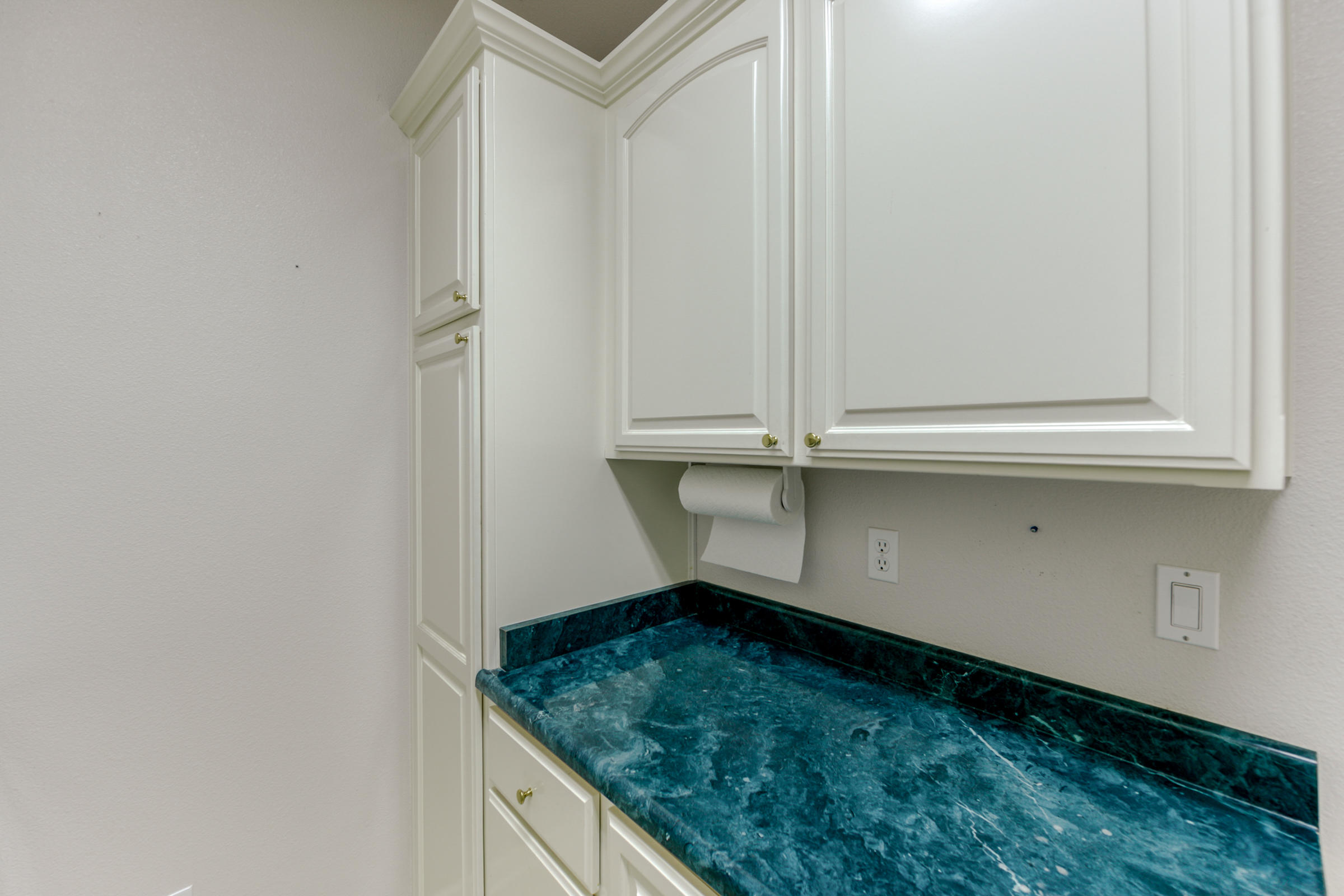 2965 Shadow Brook Lane Redding, CA 96001 - Photo 18 of 38 a bathroom with a granite countertop sink and dishwasher