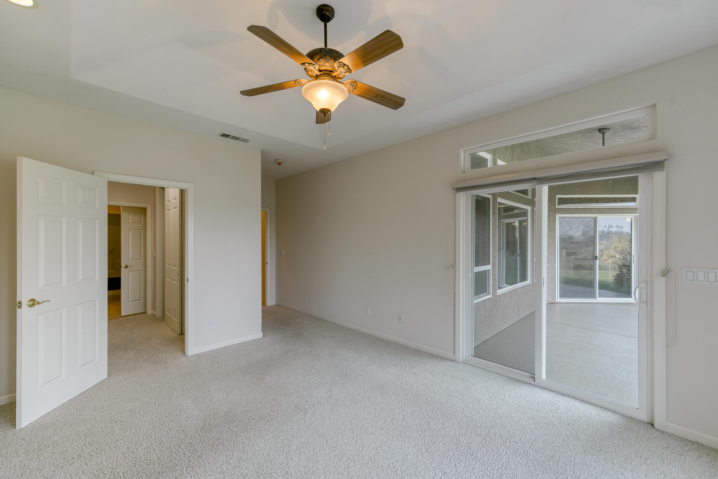 2965 Shadow Brook Lane Redding, CA 96001 - Photo 21 of 38 an empty room with a ceiling fan and a window