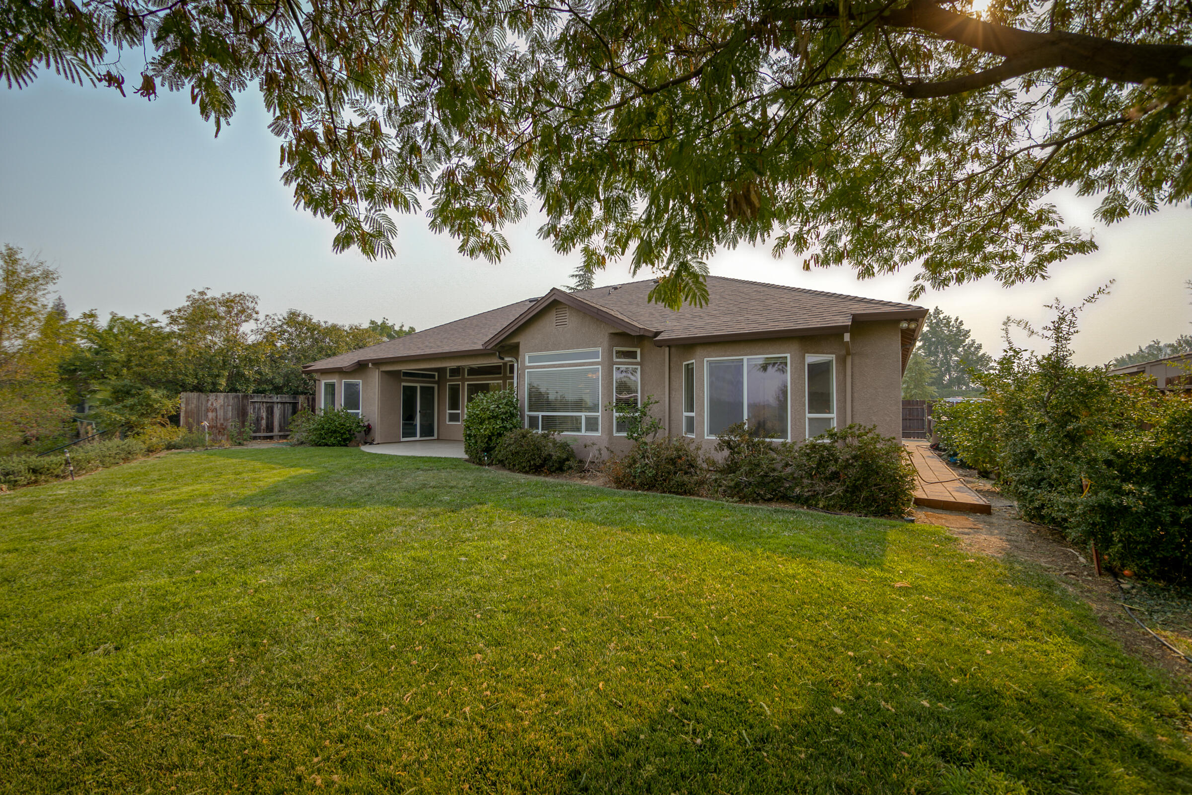 2965 Shadow Brook Lane Redding, CA 96001 - Photo 28 of 38 a front view of a house with a garden