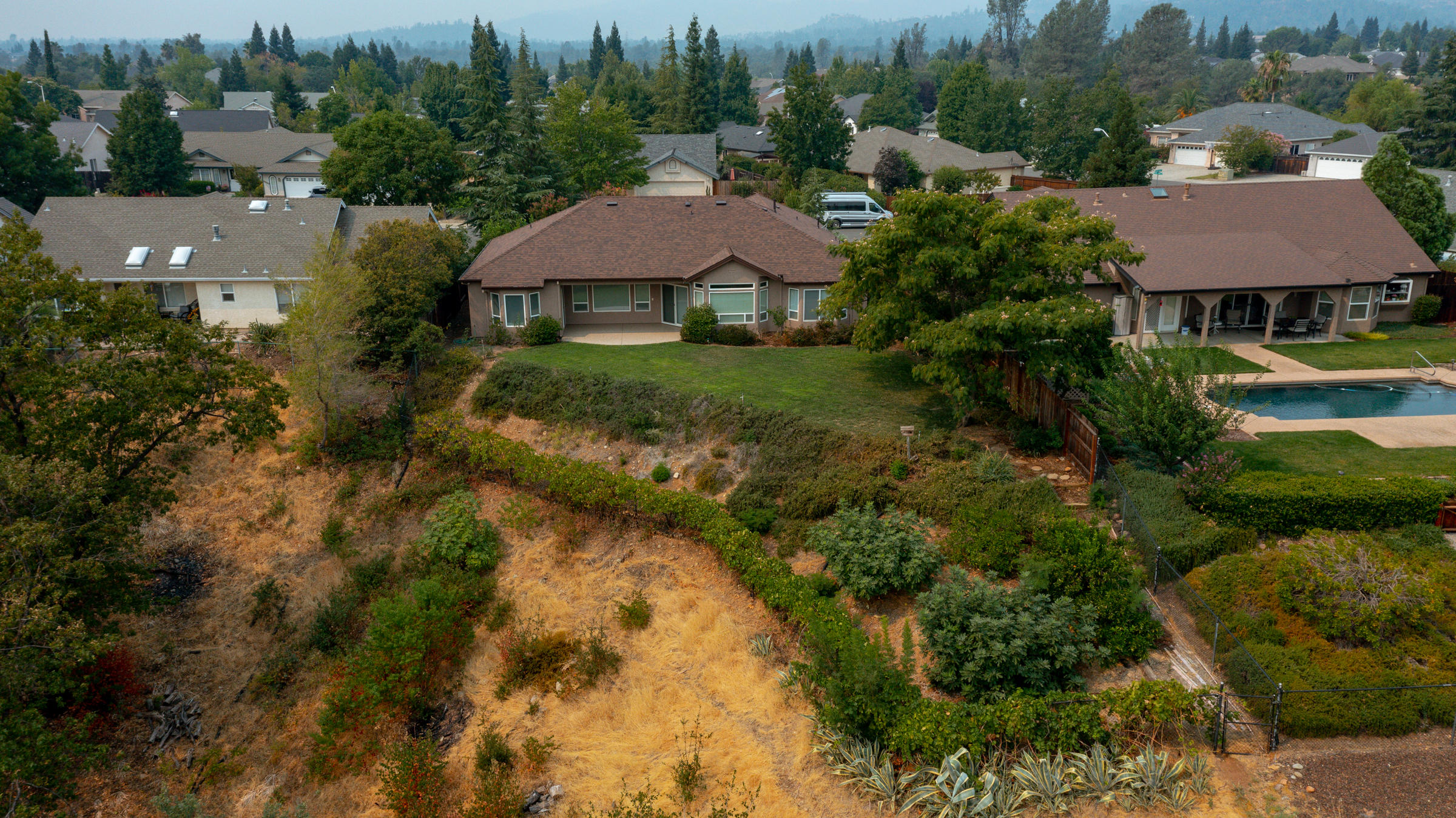 2965 Shadow Brook Lane Redding, CA 96001 - Photo 37 of 38 an aerial view of a house with a garden