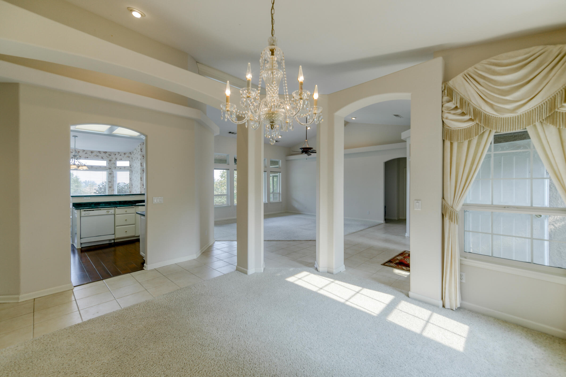 2965 Shadow Brook Lane Redding, CA 96001 - Photo 10 of 38 a view of a hallway with wooden floor and a kitchen