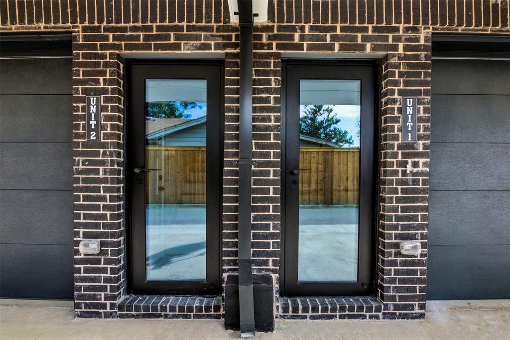 4611 Fairmount Street, Unit 102 Dallas, TX 75219 - Photo 30 of 34 a view of a brick house with front door