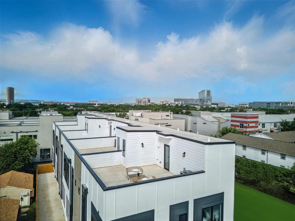 4611 Fairmount Street, Unit 102 Dallas, TX 75219 - Photo 3 of 34 a view of a patio with swimming pool and city view