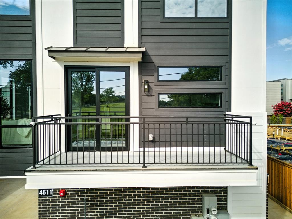 4611 Fairmount Street, Unit 102 Dallas, TX 75219 - Photo 6 of 34 a view of a brick house with a window