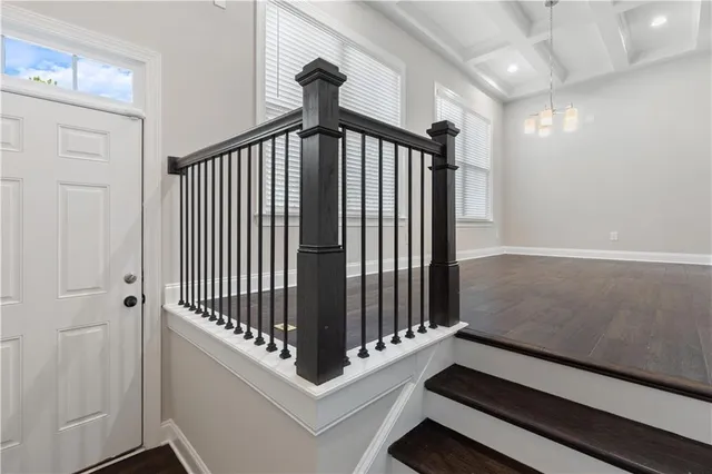 a view of staircase with white walls