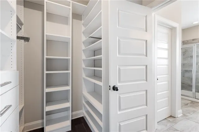 a view of an empty walk in closet