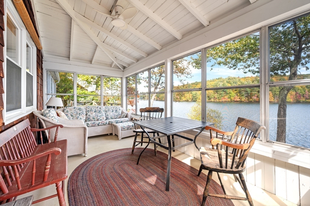 95 Crockett Road Upton, MA 01757 - Photo 12 of 26 a dining room with furniture a chandelier and wooden floor