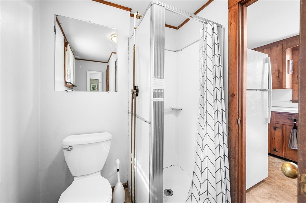 95 Crockett Road Upton, MA 01757 - Photo 13 of 26 a bathroom with a toilet and a shower