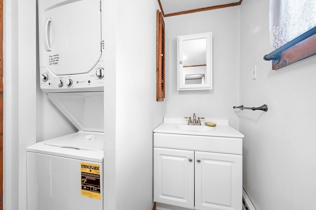 95 Crockett Road Upton, MA 01757 - Photo 14 of 26 a bathroom with a sink a toilet and mirror