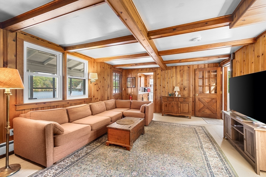 95 Crockett Road Upton, MA 01757 - Photo 17 of 26 a living room with furniture and a flat screen tv