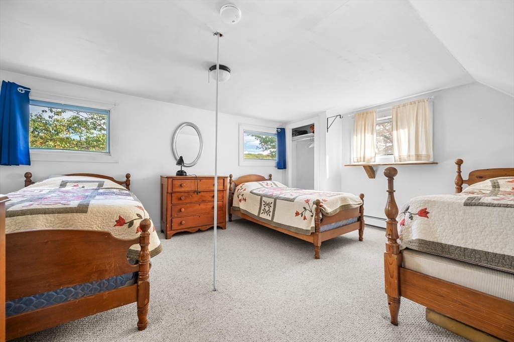 95 Crockett Road Upton, MA 01757 - Photo 20 of 26 a bedroom with two beds and window