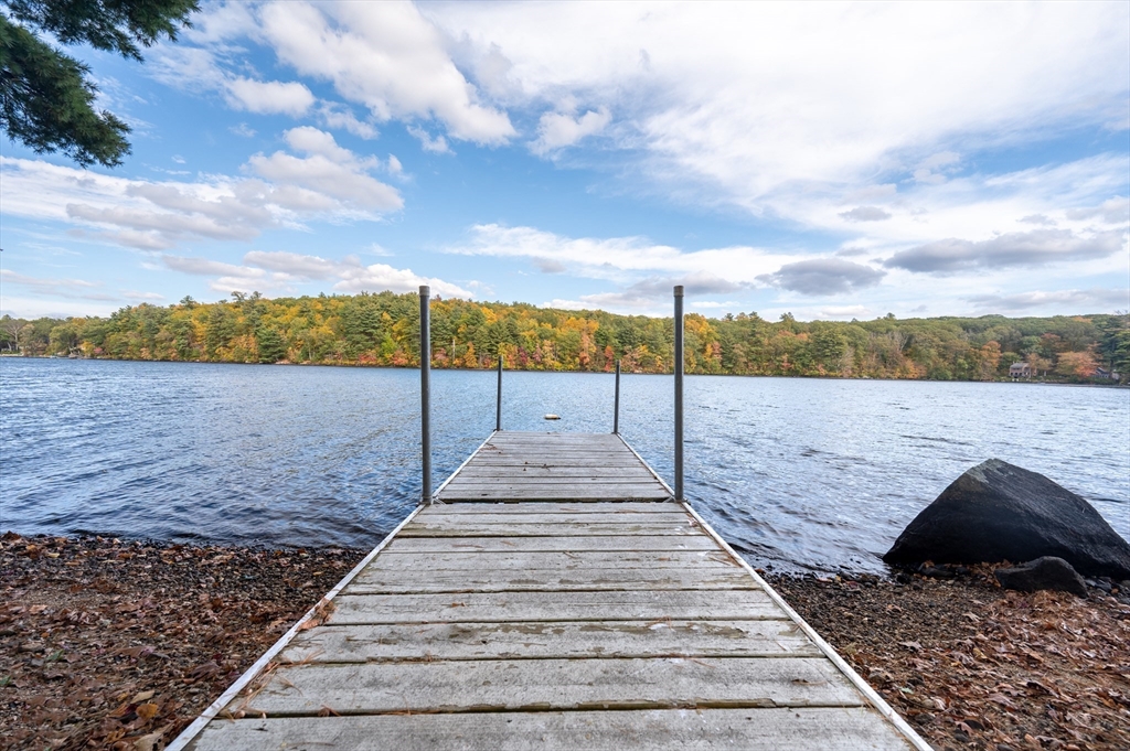 95 Crockett Road Upton, MA 01757 - Photo 2 of 26 a view of a pathway with a wrought fence
