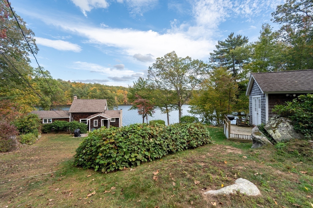 95 Crockett Road Upton, MA 01757 - Photo 21 of 26 a view of a garden with a house in the background