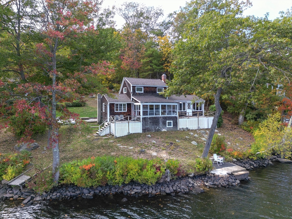 95 Crockett Road Upton, MA 01757 - Photo 4 of 26 a view of a big house with a big yard plants and large trees