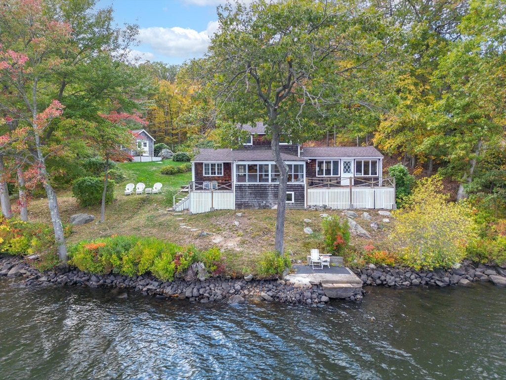 95 Crockett Road Upton, MA 01757 - Photo 5 of 26 front view of a house with a yard and large trees