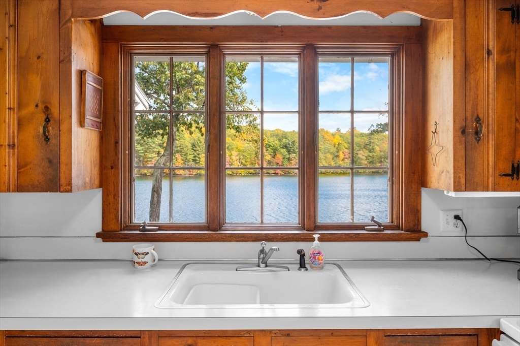 95 Crockett Road Upton, MA 01757 - Photo 8 of 26 a bathroom with a granite countertop sink and a window