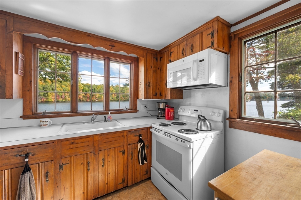 95 Crockett Road Upton, MA 01757 - Photo 10 of 26 a kitchen with stainless steel appliances granite countertop a sink a stove and a refrigerator