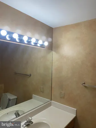 a bathroom with a shower a toilet and a sink