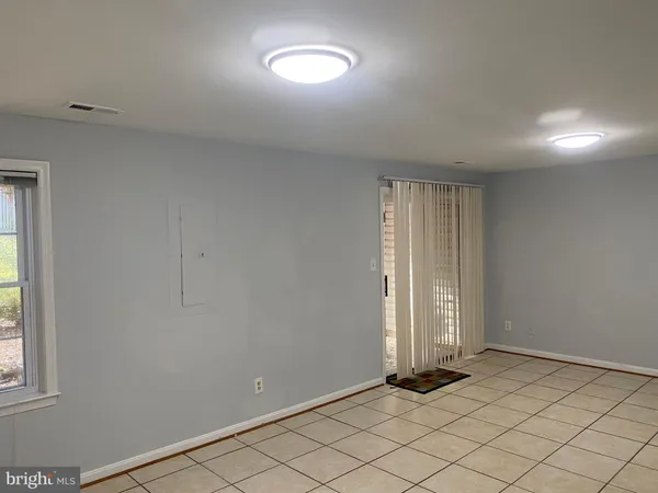 a bathroom with a granite countertop toilet and a shower