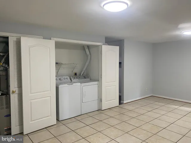 a white toilet sitting next to a shower