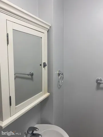 a view of street with wooden deck and trees