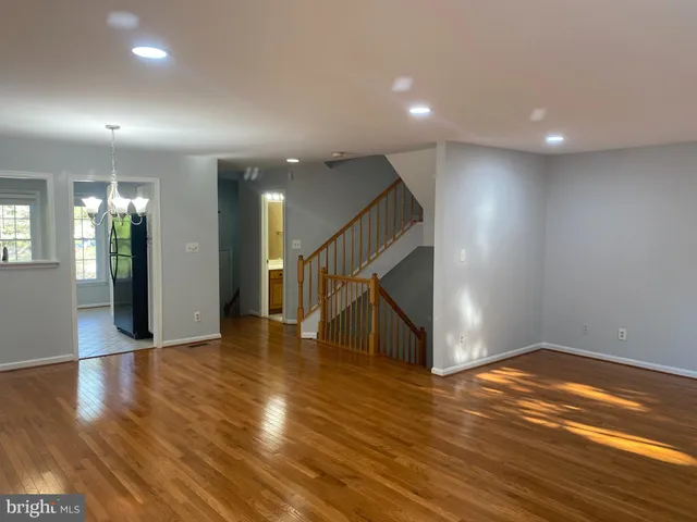 a view of an entryway with wooden floor