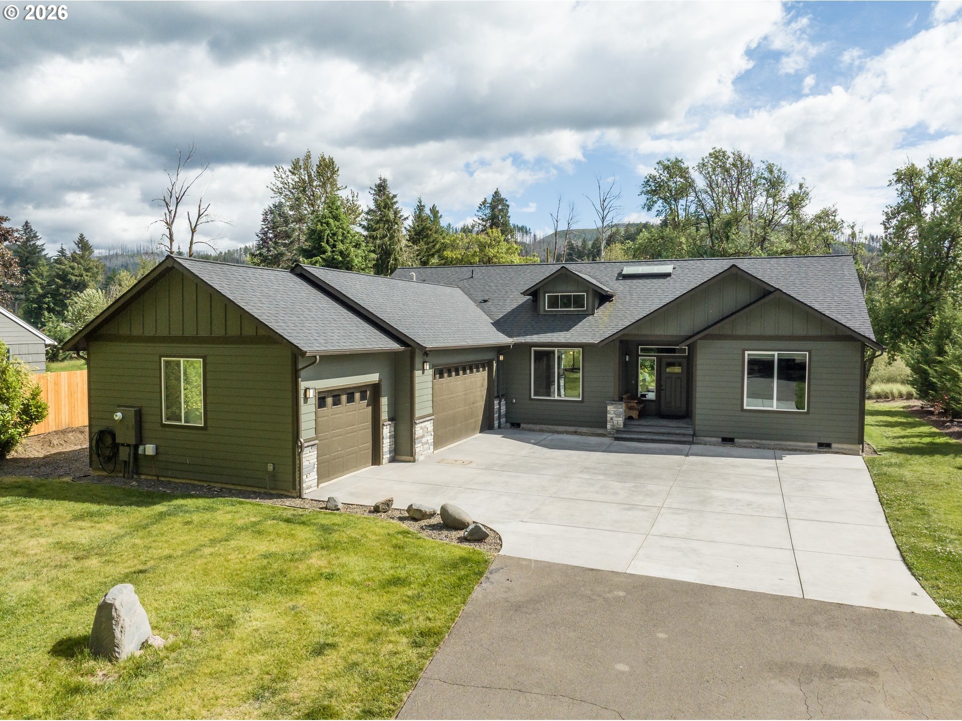 45542 South Gate Creek Road Vida, OR 97488 - Photo 23 of 46 a front view of a house with a yard