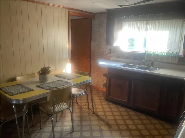 a view of a kitchen area with furniture and window