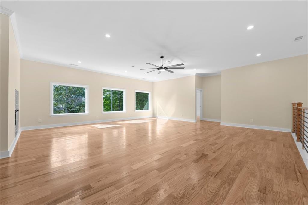 5011 Colton Run Atlanta, GA 30349 - Photo 11 of 12 a view of an empty room with window and wooden floor