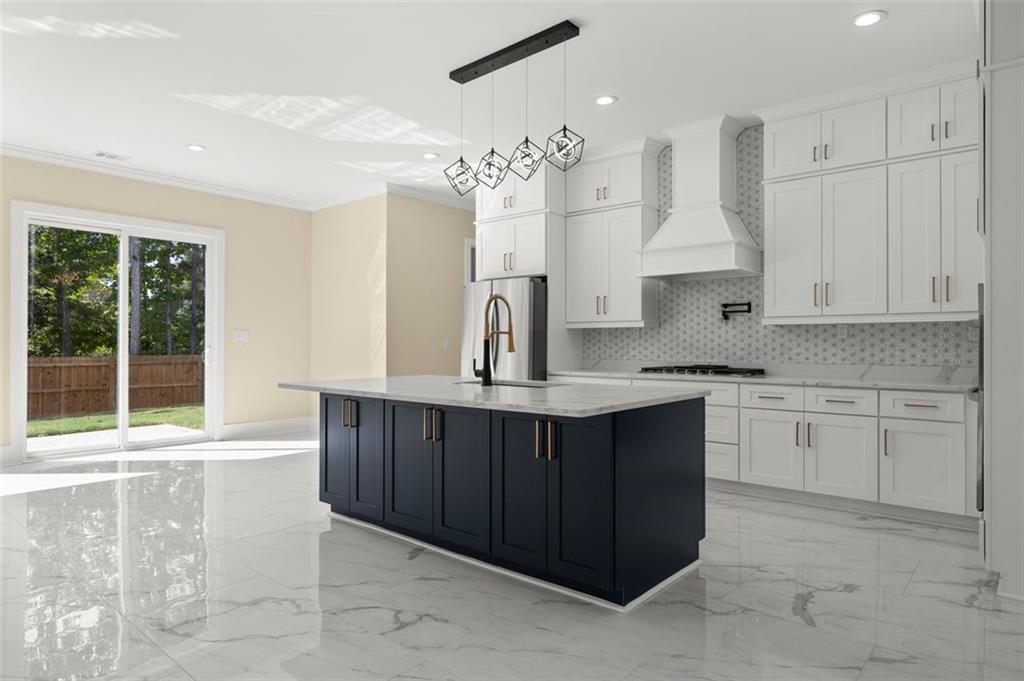 5011 Colton Run Atlanta, GA 30349 - Photo 4 of 12 a kitchen with a sink stove and cabinets