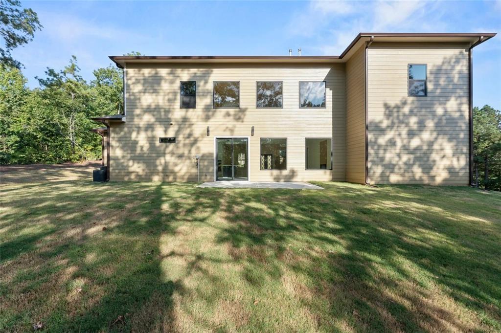 5011 Colton Run Atlanta, GA 30349 - Photo 8 of 12 a front view of house with yard